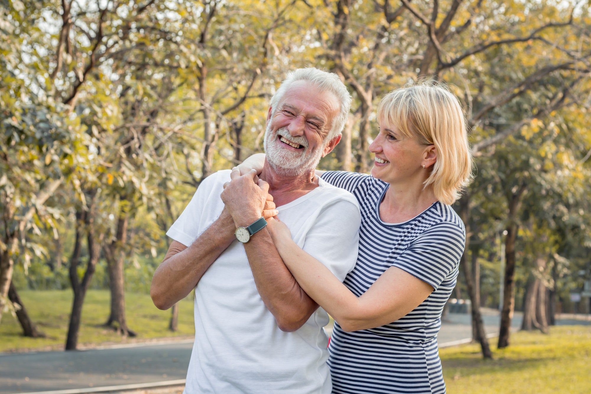 Vancouver couple walking in the fall and discussing their Medigap plan.
