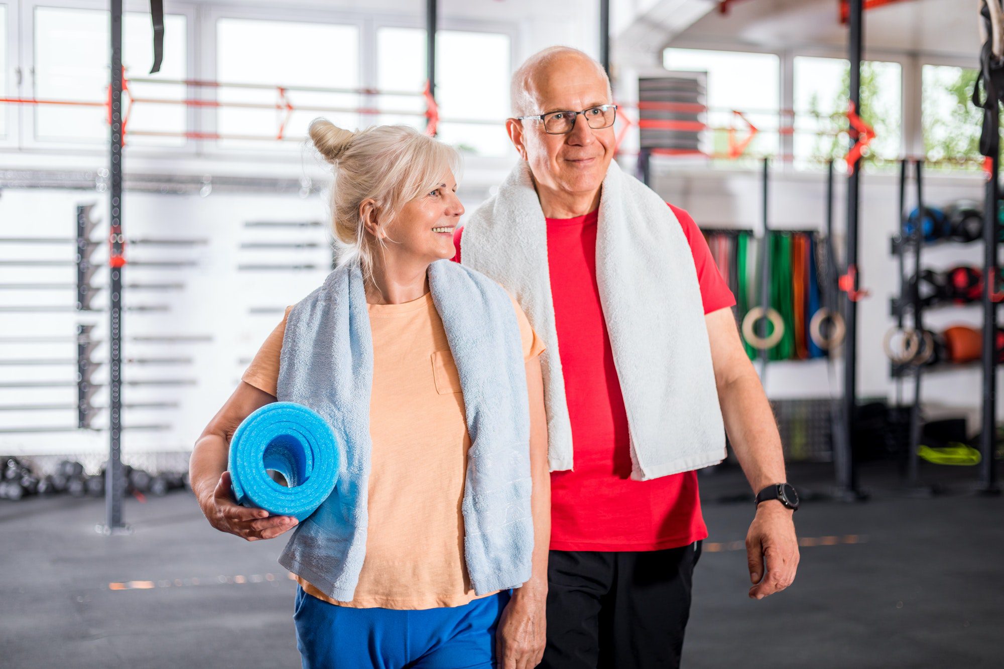 Vancouver senior couple in the gym working out as they discuss their Vancouver Medicare Plan.