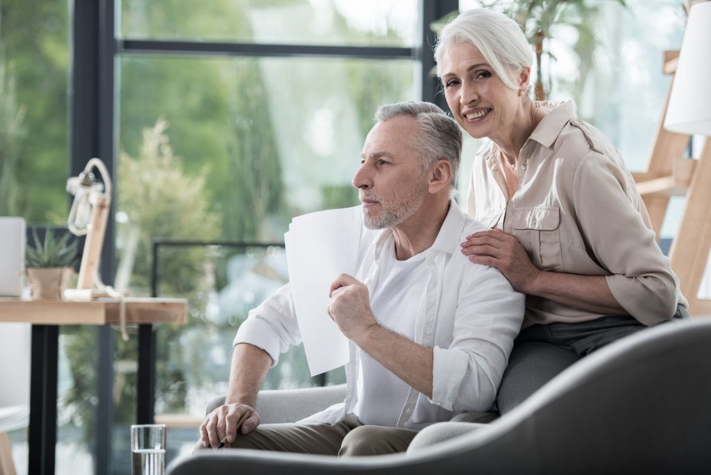 Happy seniors reading over the coverage of Medigap Plan G.
