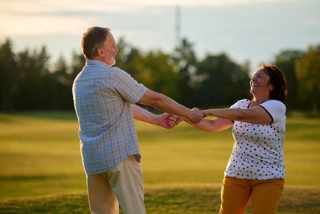Happy senior couple enjoying time together as they discuss medicare supplement plan comparisons.